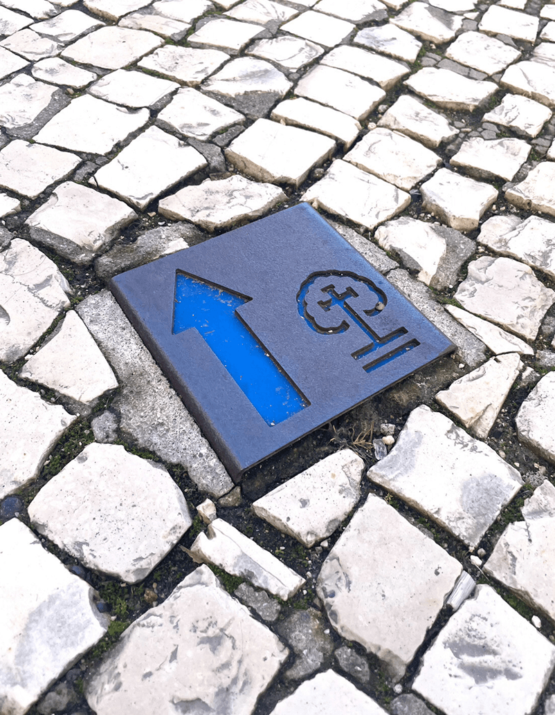 Pavement marking for religious routes, Fatima path in steel with HPL plate.